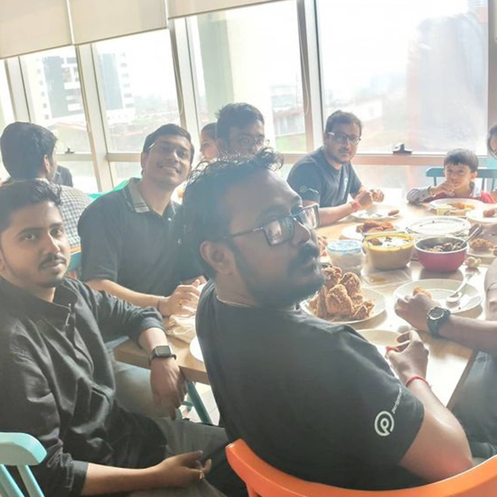 performance-io employees having lunch at a potluck party